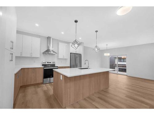 313 Baneberry Way Sw, Airdrie, AB - Indoor Photo Showing Kitchen With Upgraded Kitchen