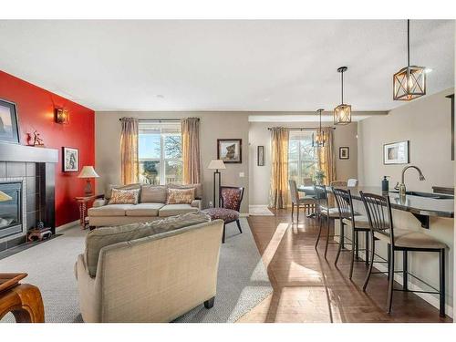 32 St Moritz Terrace Sw, Calgary, AB - Indoor Photo Showing Living Room With Fireplace