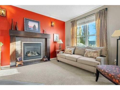 32 St Moritz Terrace Sw, Calgary, AB - Indoor Photo Showing Living Room With Fireplace