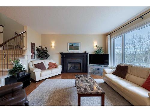 42 Tuscany Estates Crescent Nw, Calgary, AB - Indoor Photo Showing Living Room With Fireplace