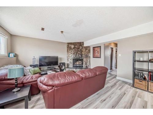 7803 34 Avenue Nw, Calgary, AB - Indoor Photo Showing Living Room With Fireplace