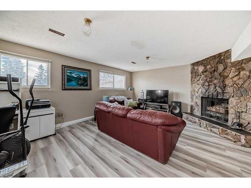 7803 34 Avenue Nw, Calgary, AB - Indoor Photo Showing Living Room With Fireplace