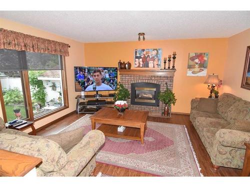 163 Shannon Circle Sw, Calgary, AB - Indoor Photo Showing Living Room With Fireplace