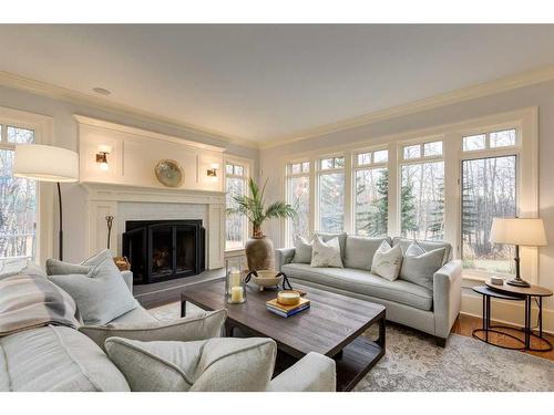 111 Woodland Lane, Rural Rocky View County, AB - Indoor Photo Showing Living Room With Fireplace