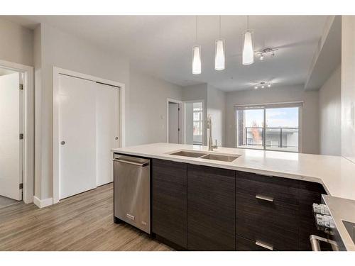 1313-95 Burma Star Road Sw, Calgary, AB - Indoor Photo Showing Kitchen With Double Sink