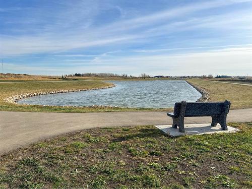 802 Mandalay Link, Carstairs, AB - Outdoor With Body Of Water With View