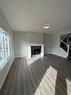 1607 Baywater Street Sw, Airdrie, AB  - Indoor Photo Showing Living Room With Fireplace 