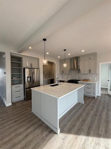 1607 Baywater Street Sw, Airdrie, AB - Indoor Photo Showing Kitchen With Upgraded Kitchen