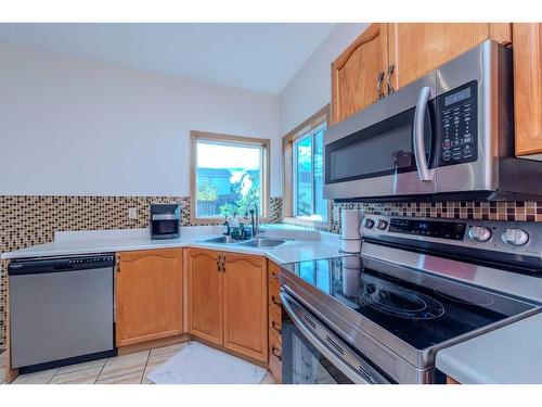 14993 5 Street Sw, Calgary, AB - Indoor Photo Showing Kitchen With Double Sink