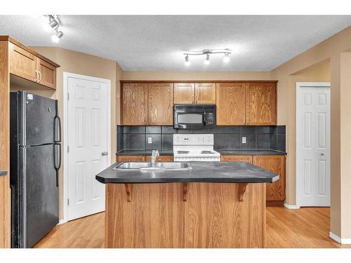 20 Taralake Lane Ne, Calgary, AB - Indoor Photo Showing Kitchen With Double Sink