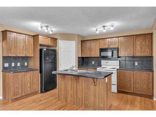 20 Taralake Lane Ne, Calgary, AB - Indoor Photo Showing Kitchen With Double Sink