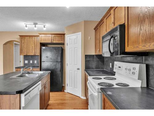 20 Taralake Lane Ne, Calgary, AB - Indoor Photo Showing Kitchen With Double Sink