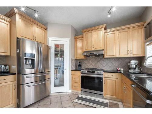 75 West Cedar Rise Sw, Calgary, AB - Indoor Photo Showing Kitchen With Stainless Steel Kitchen