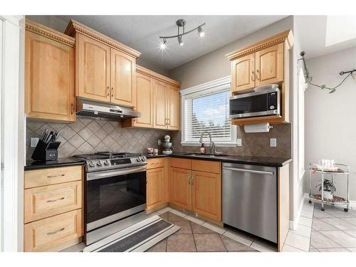 75 West Cedar Rise Sw, Calgary, AB - Indoor Photo Showing Kitchen With Stainless Steel Kitchen