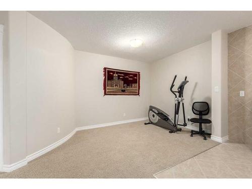 75 West Cedar Rise Sw, Calgary, AB - Indoor Photo Showing Gym Room