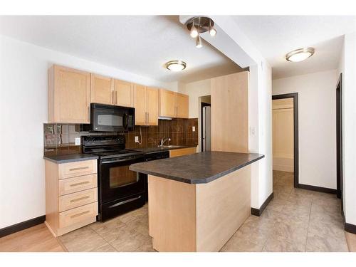 202-620 15 Avenue Sw, Calgary, AB - Indoor Photo Showing Kitchen With Double Sink