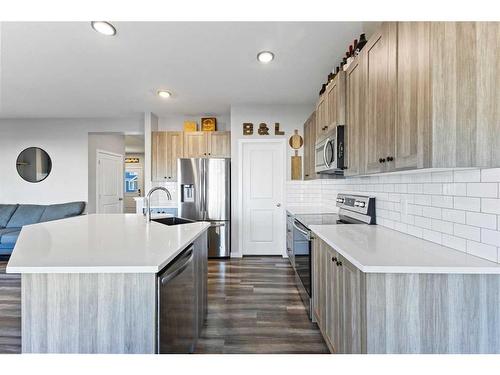 1064 Chinook Gate Heath Sw, Airdrie, AB - Indoor Photo Showing Kitchen With Stainless Steel Kitchen