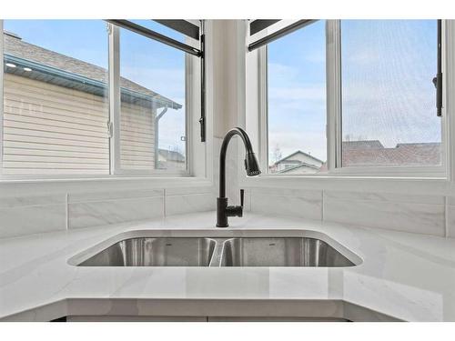 135 Mt Apex Crescent Se, Calgary, AB - Indoor Photo Showing Kitchen With Double Sink