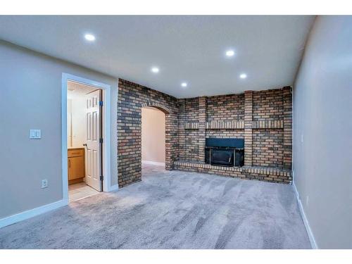 379 Whitman Place Ne, Calgary, AB - Indoor With Fireplace