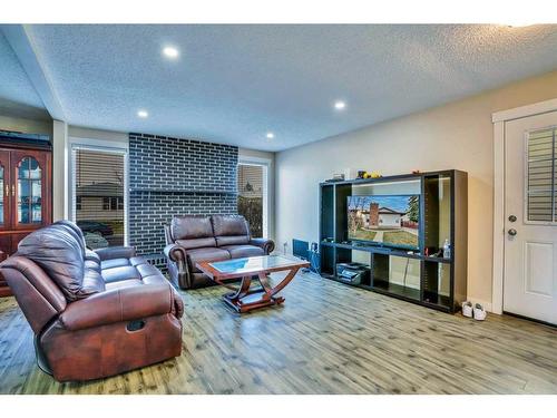 379 Whitman Place Ne, Calgary, AB - Indoor Photo Showing Living Room With Fireplace