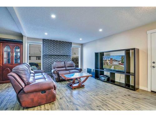 379 Whitman Place Ne, Calgary, AB - Indoor Photo Showing Living Room With Fireplace