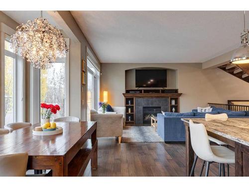 8 West Grove Bay Sw, Calgary, AB - Indoor Photo Showing Dining Room With Fireplace