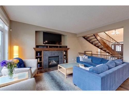 8 West Grove Bay Sw, Calgary, AB - Indoor Photo Showing Living Room With Fireplace