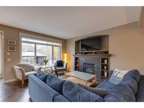 8 West Grove Bay Sw, Calgary, AB - Indoor Photo Showing Living Room With Fireplace