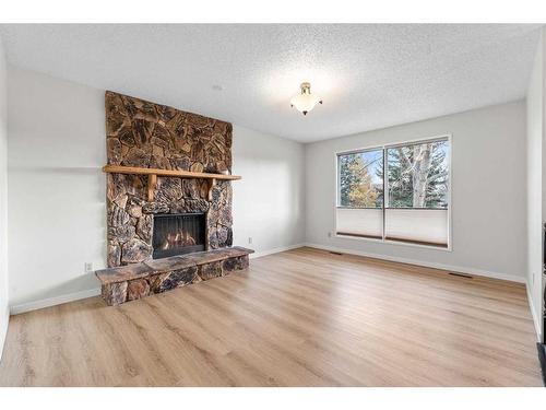 12 Glenport Road, Cochrane, AB - Indoor Photo Showing Living Room With Fireplace