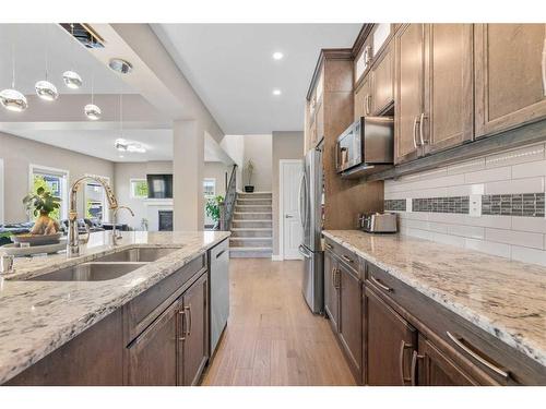 201 Aspenmere Way, Chestermere, AB - Indoor Photo Showing Kitchen With Double Sink With Upgraded Kitchen