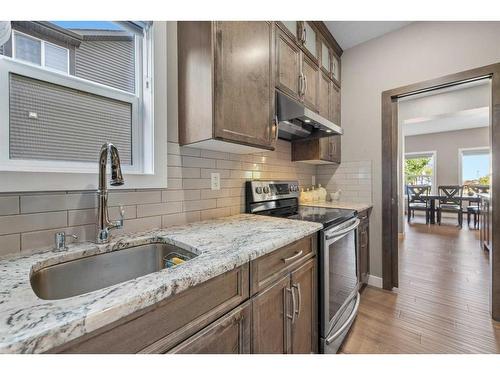 201 Aspenmere Way, Chestermere, AB - Indoor Photo Showing Kitchen With Stainless Steel Kitchen With Upgraded Kitchen