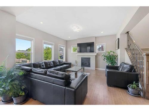 201 Aspenmere Way, Chestermere, AB - Indoor Photo Showing Living Room With Fireplace