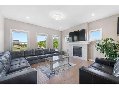 201 Aspenmere Way, Chestermere, AB - Indoor Photo Showing Living Room With Fireplace