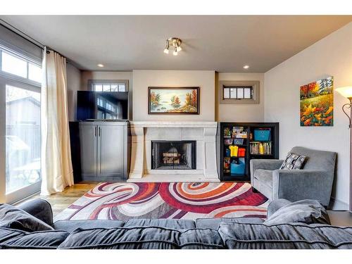 140 35 Street Nw, Calgary, AB - Indoor Photo Showing Living Room With Fireplace