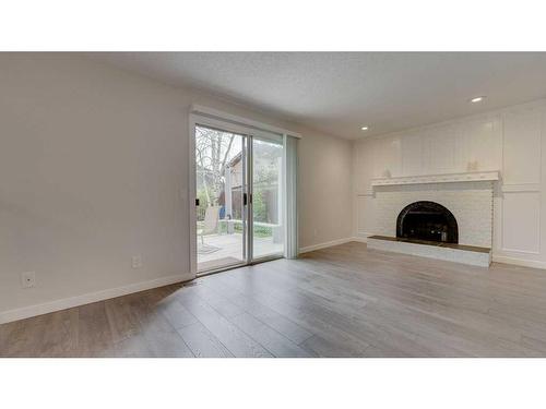 84 Templevale Way Ne, Calgary, AB - Indoor Photo Showing Living Room With Fireplace