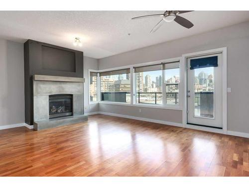 204-1828 14 Street Sw, Calgary, AB - Indoor Photo Showing Living Room With Fireplace