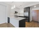 1409-95 Burma Star Road Sw, Calgary, AB  - Indoor Photo Showing Kitchen With Double Sink With Upgraded Kitchen 