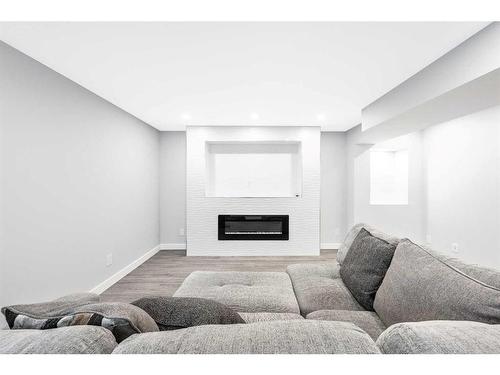 28 Walgrove Landing Se, Calgary, AB - Indoor Photo Showing Living Room With Fireplace