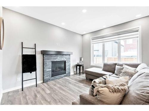 28 Walgrove Landing Se, Calgary, AB - Indoor Photo Showing Living Room With Fireplace