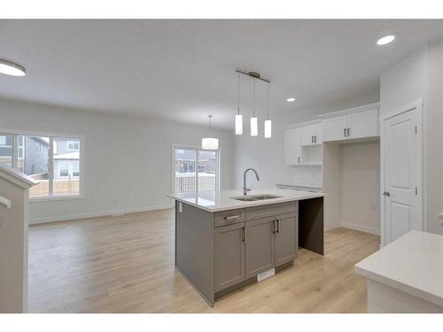 70 Saddlebred Place, Cochrane, AB - Indoor Photo Showing Kitchen With Double Sink