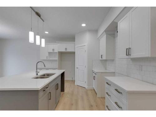 70 Saddlebred Place, Cochrane, AB - Indoor Photo Showing Kitchen With Double Sink With Upgraded Kitchen