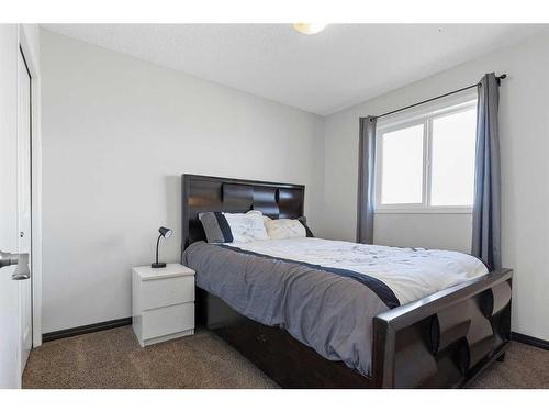 716 River Heights Crescent, Cochrane, AB - Indoor Photo Showing Bedroom