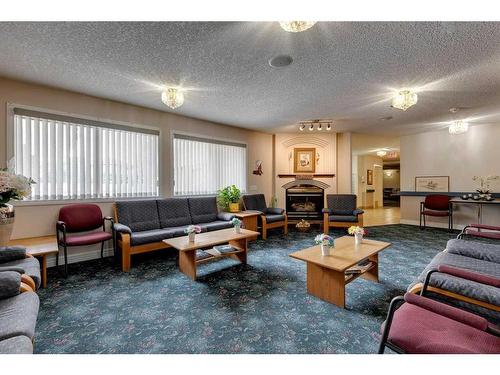 3338-1818 Simcoe Boulevard Sw, Calgary, AB - Indoor Photo Showing Living Room