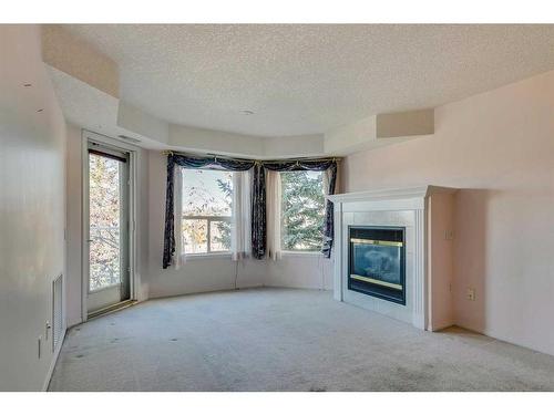 3338-1818 Simcoe Boulevard Sw, Calgary, AB - Indoor With Fireplace