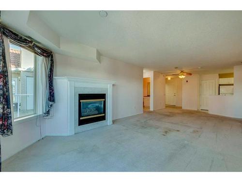 3338-1818 Simcoe Boulevard Sw, Calgary, AB - Indoor With Fireplace