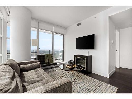 2802-1188 3 Street Se, Calgary, AB - Indoor Photo Showing Living Room With Fireplace