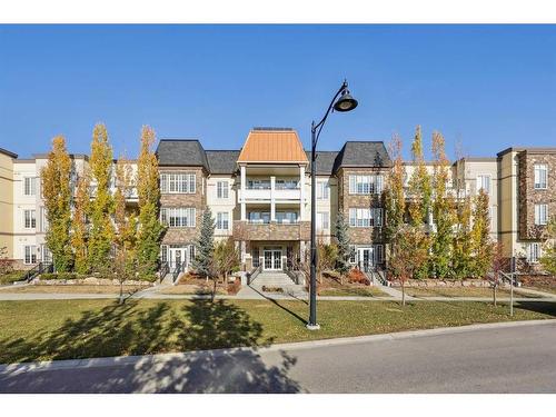 311-39 Quarry Gate Se, Calgary, AB - Outdoor With Facade