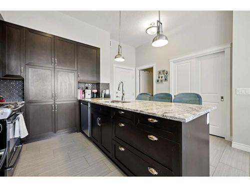 311-39 Quarry Gate Se, Calgary, AB - Indoor Photo Showing Kitchen