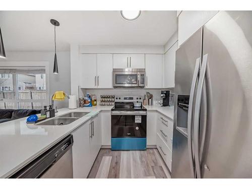 5102-302 Skyview Ranch Drive Ne, Calgary, AB - Indoor Photo Showing Kitchen With Stainless Steel Kitchen With Double Sink