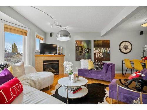 32 Patina Terrace Sw, Calgary, AB - Indoor Photo Showing Living Room With Fireplace